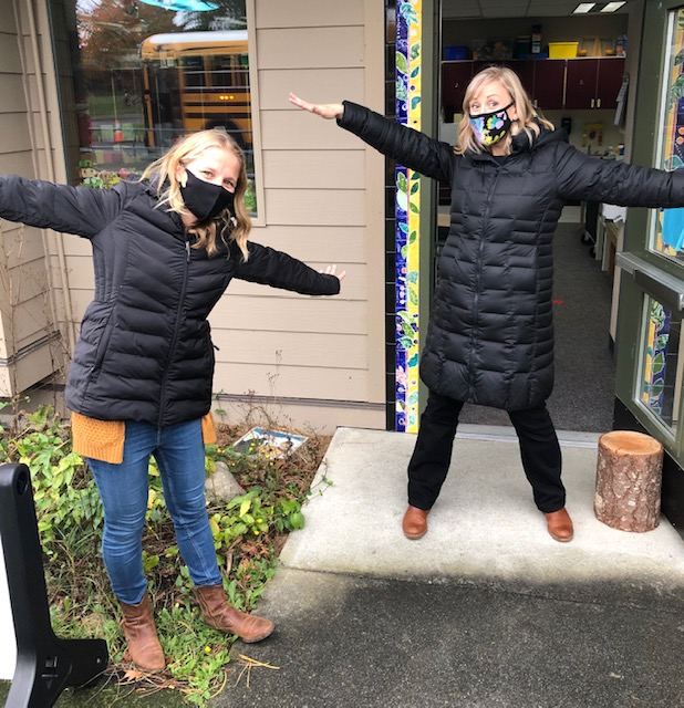 Happy teachers welcoming students
